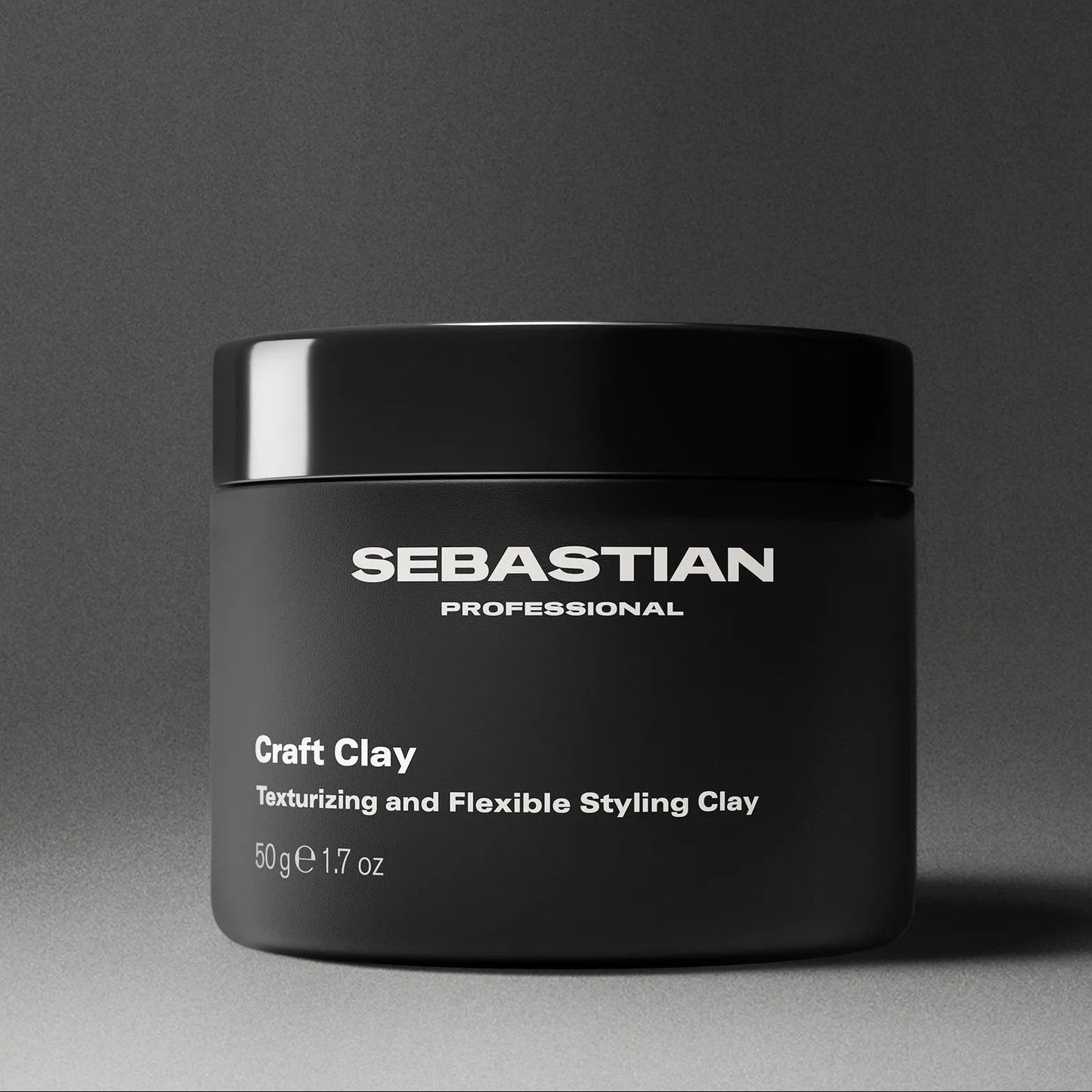 Black jar of Sebastian Professional Craft Clay on a gray background